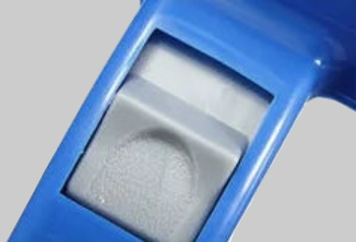 Blue handheld device with a clear plastic component on a white background